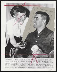 He Will Be Wearing The Lowcuts From Now On. Curt Simmons and wife, Dorothy, inspect baseball shoes which have been unused since 1950 at his homehere.tonight. The Phillies southpaw will trade in his Army boots at Camp Kilmer, N.J., this week after duty in Germany.
