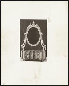 An 18th Century Mirror-- Although mirrors for men were undoubtedly less elaborate than this 18th century salem looking glass, the form of the hinged glass and table has always been popular with either sex.