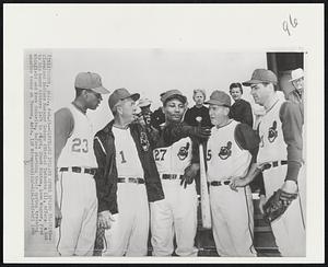 Cleveland Indians Opens Spring Training--Cleveland Indians Manager George (Birdie) Tebbetts (1), offers a bat to his heavy hitters left to right, Chuck Hinton, Leon Wagner, Fred Whitfield and Rock Colavito, before starting their spring training session today at Tucson, Ariz.
