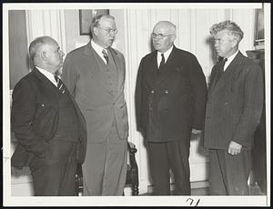 Executives of the Motor Truck Club of Massachusetts shown with Mayor Mansfield this morning at City Hall, where he indorsed their safety drive contest for truck drivers now in its third month. Prizes will amount to more than $2000. Left to right: Capt. E. C. Benway, Mayor Mansfield, Timothy Lyons and Frank Flanagan.