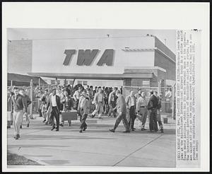 Kansas City – Strike Against Airline – Workers leave their jobs at the Midcontinent International Airport today in a strike against Trans World Airlines, which has its main overhaul base at the airport. The International Association of Machinists called the strike. The men walked off just as the union announced the airline had made a new proposal in negotiations.