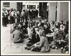A group of protesters sitting, Boston City Hall Plaza