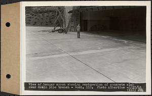 Contract No. 118, Miscellaneous Construction at Winsor Dam and Quabbin Dike, Belchertown, Ware, view of hangar apron showing restoration of concrete slab over drain pipe trench, Ware, Mass., Aug. 27, 1945