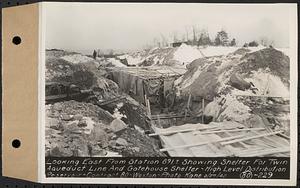 Contract No. 80, High Level Distribution Reservoir, Weston, looking east from Sta. 891+/- showing shelter for twin aqueduct line and gatehouse shelter, high level distribution reservoir, Weston, Mass., Feb. 27, 1940