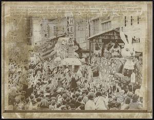 New Orleans is bracing for Mardi Gras, its ever growing festival of beads, bands, balls, booze and babes. Here, thousands jam historic Canal Street to climax the carnival season in this 1966 file photo.