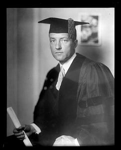 An unidentified man wearing a cap and gown