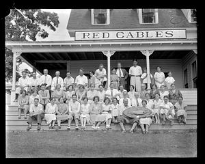 A group of people posing in front of "Red Gables"