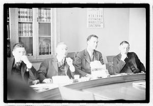 Group of men at table