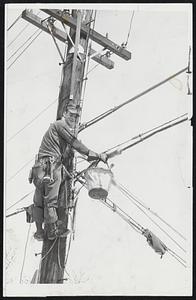 Who Crossed the Weather Wires?-Linemen working their high jobs, like Ronald Simonds, were a familiar sight after the storm-caused power breaks.