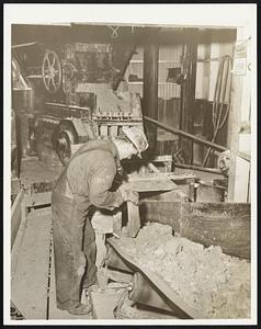 A Vital Wartime Metal - Rhodochrosite Ore, or manganese carbonate in combination with sulphides of zinc and lead comes to the surface of the Emma mine in "skips" and is then dumped on a belt conveyor for loading into trucks carrying it to the reduction plant of the Anaconda Copper Mining Company.