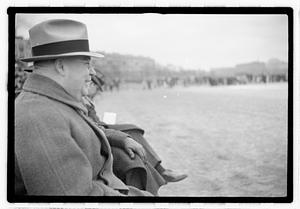 Boston Parks Department Commissioner William Long watching a football game, Back Bay Fens