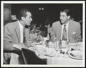 Stoking Up Before The Battle – Shortstop Chico Carrasquel and Pitcher Luis Aloma at Chicago White Sox enjoy leisurely meal at Kenmore before departing for Fenway Park and opener of three-game set with Red Sox last night.