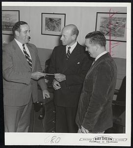 Raytheon Aids Medical Center – Richard Preston, left, acting chairman of the Children’s Medical Center Fund, receives $17,500 check from Charles Francis Adams, Jr., president of Raytheon Company, as the company's joint management and employe contribution to the fund. At right is Walter J. Brown, president of Local 1505, Electrical Workers Union, AFL.