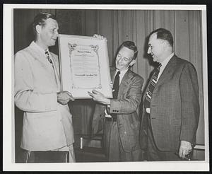 Prof. Ray M. Koon, head of the Waltham Field Station and president of the Massachusetts Agricultural Club, together with Arno H. Nehrling, secretary, presenting plaque to His Excellency Maurice J. Tobin, Governor of Massachusetts, as a token of their appreciation for the interest the Governor has taken in the state agricultural program.