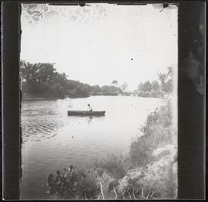 Man in rowboat on Blakes Mills pond