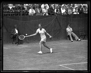 A tennis player playing a match