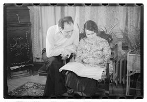 John and Maude Sanromá looking at a musical score
