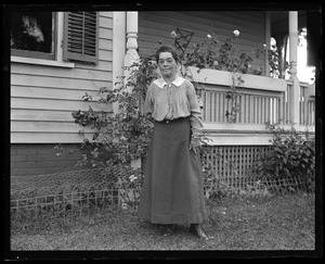 Aunt Kate, in front of house