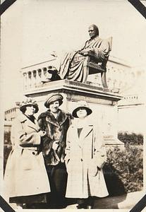 Three women in front of statue of Chief Justice John Marshall, Washington, D.C.