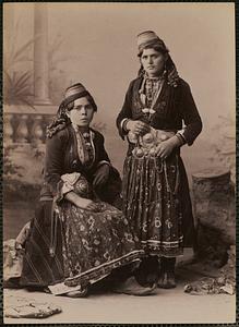 Studio portrait of two women in traditional Greek dress