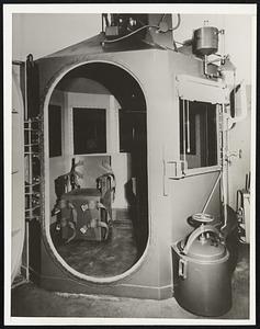 Gas Chamber Awaits First Condemned Woman. San Quentin Prison, Calif.. This is San Quentin’s gas chamber, where Mrs. Juanita Spinelly - the “Duchess” - is to die of cyanide fumes tomorrow. It contains two chairs and the Duchess is to be executed in the number 2 chair shown through the entrance in the picture. Two fellow gang members are scheduled to die together one week later. The three were convicted of the murder of a fourth member of the gang.
