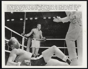 The referee calls the count over a dazed Amos Johnson, who lies on the floor of the ring after being knocked down by Sonny Liston in the third round of their bout 8/19 in Gothenburg. Liston, leaning on the ropes in a neutral corner, (background), looks out at the fans and shows little interest in proceedings in the ring. Liston won the fight.