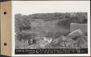 Contract No. 66, Regulating Dams, Middle Branch (New Salem), and East Branch of the Swift River, Hardwick and Petersham (formerly Dana), looking easterly at fill on east branch regulating dam, Hardwick, Mass., Sep. 12, 1939