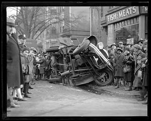Car flips on to sidewalk
