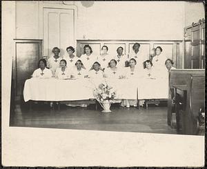 A group of women wearing the same outfit