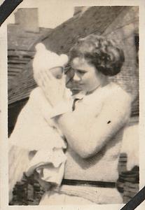 Unidentified woman holding infant