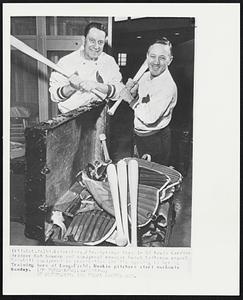 Petersburg. Fla.-Springs here! St Louis Cardinals trainer Bob Bauman and equipment manager Butch Yatkeman unpack baseball equipment in preparation for the opening of Spring Training here at Langfield. Rookie pitchers start workouts Monday.