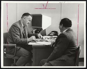 Jobless Technician is interviewed by Richard White, left, one of employment counsellors, at Rte. 128 Professional Service Center.