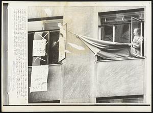 Peace Corps 'Liberated' -- A Viet Cong flag is stretched from a fourth-floor window of Peace Corps headquarters in Washington today after a group calling themselves the Committee of Returned Volunteers took over some of the offices. They said they "liberated a wing of the Peace Corps building."
