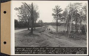 Contract No. 80, High Level Distribution Reservoir, Weston, looking west from Sta. 74+00, showing condition of dam 4, placing of riprap, high level distribution reservoir, Weston, Mass., May 29, 1940