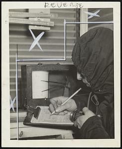 Aubrey Hustead, junior meteorologist, U.S. Weather Bureau, recording the readings one of the outside shelters for thermometers and humidity-recording instruments.