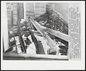 Quake Damage--This is general scene in the law library of the county courthouse here, after an earthquake shook this area yesterday. Filing cabinets and records were tumbled over each other.