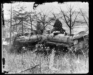 People looking at a train accident