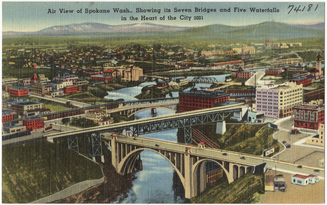 Air view of Spokane Wash., showing its seven bridges and five waterfalls in the heart of the city