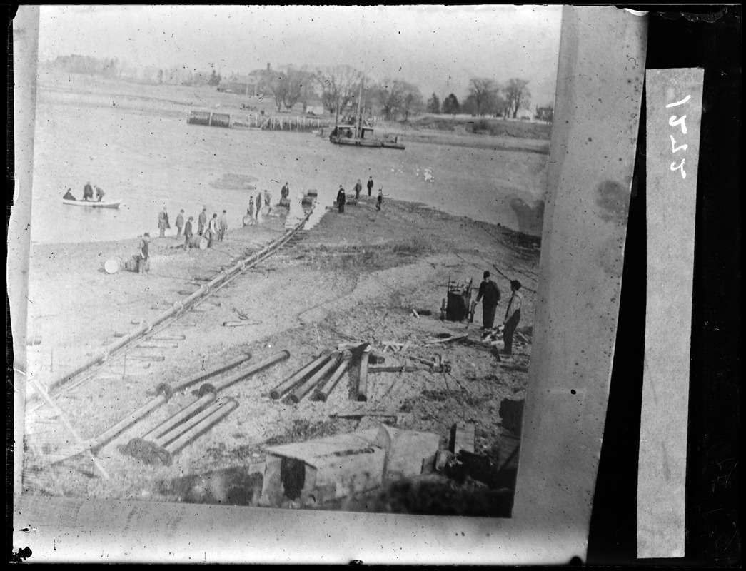 Laying water pipe across Town River to Germantown