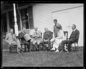 Pres. Coolidge's Plymouth Vt. home. From L to R: Harvey Firestone, Pres. Coolidge, Henry Ford, Thomas Edison, Harvey Firestone Jr. (standing), Mrs. Coolidge, Col. Coolidge. "Money & brains"