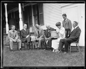 Money and brains at Pres. Coolidge's Plymouth Vt. home. Left to right: Harvey Firestone, Pres. Coolidge, Henry Ford, Thomas Edison, Mrs. Coolidge, Harvey Firestone Jr. (standing), Col Coolidge.