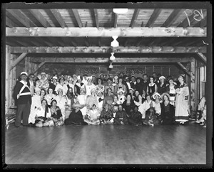 Group in costume pose in barn.