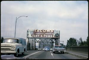 View down Puyallup Avenue Bridge with "Tacoma Publicly Owned Light & Power" sign, Tacoma, Washington