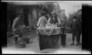 Man at table in marketplace