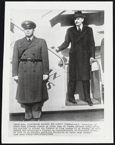 Acheson Arrives for King's Funeral--U.S. Secretary of State Dean Acheson stands on plane ramp at London airport today after his arrival to attend the funeral of King George VI on Friday. He will attend the sovereign's funeral as representative of President Truman. At left is an airport guard.