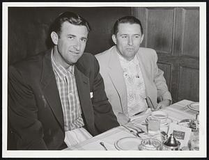 Early Dinner Before Tardy Opening of series with Red Sox at Fenway Park is enjoyed by Mickey Vernon (left) and Frank Shea of Nationals at Hotel Kenmore. Afternoon game was postponed, but teams opened five-game series last night.