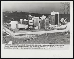 Tornado Exposes Home Furnishings--The tornado which struck here today removed the roof and sides of this home and left the household furnishings intact.