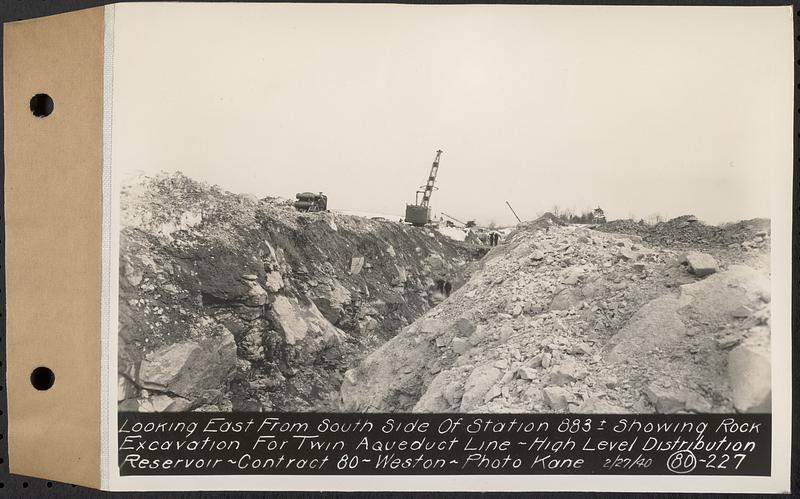 Contract No. 80, High Level Distribution Reservoir, Weston, looking east from south side of Sta. 883+/- showing rock excavation for twin aqueduct line, high level distribution reservoir, Weston, Mass., Feb. 27, 1940