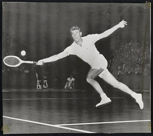 Sedgman Victor in Pro Net Debut-Frank Sedgman of Australia shows his court speed as he goes after a Jack Kramer drive in winning his first match as a professional last night in Los Angeles. The Davis Cup star topped the pro king, 3-6, 6-4, 6-4.