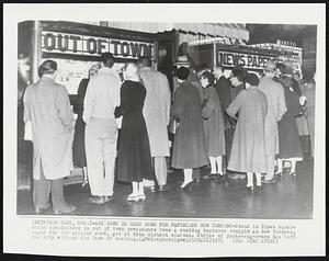 Any News is Good News for Paperless New Yorkers-Stand in Times Square which specializes in out of town newspapers does a rushing business tonight as New Yorkers, eager for the printed word, get it from distant sources. Strike of photo-engravers has left the city without its fare of reading.